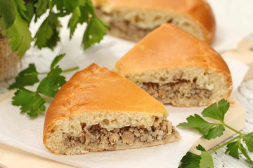 Traditional russian pie with meat and rice