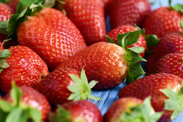 strawberries on a blue wooden surface