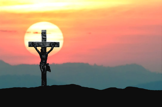 Silhouette Jesus and the cross over sunset on mountain top with copy space (Painting draw water color)