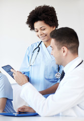 group of happy doctors meeting at hospital office