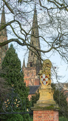 Lion statue with Lichfield cathedral