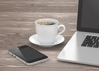 Fototapeta na wymiar Laptop smartphone and coffee cup on wood table