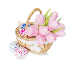 Fototapeta na wymiar Basket with flowers and Easter eggs