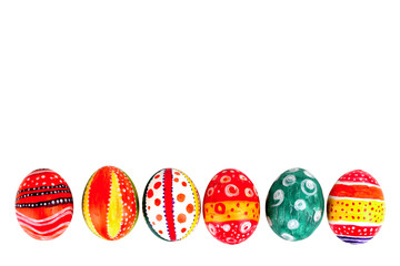 Easter eggs in beautiful and different colors on a white isolated background