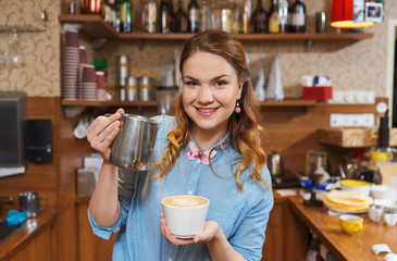 barista woman pouring cream to cup at coffee shop