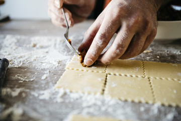 Man making ravioli, Italian cuisine and gluten-free - 104748326