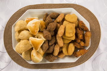 Mixed brazilian snack on the table.