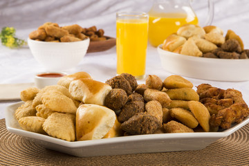 Mixed brazilian snack on the table.