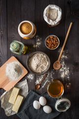 Fototapeta na wymiar Ingredients for baking on a wooden background top view