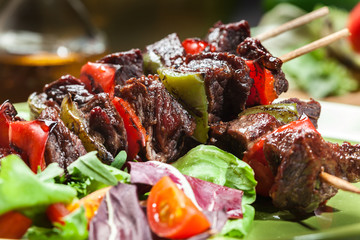 Grilled beef meat and vegetable kebabs