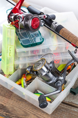 fishing tackles and baits in box
