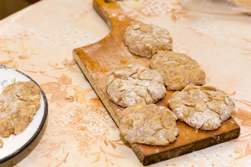 Prepared meatballs for frying on the kitchen table