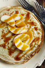 Crepes with apple and caramel sauce
