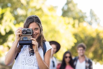 Hip woman taking picture of the camera