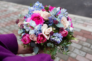 Beautiful bouquet in female hands