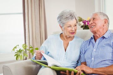 Senior couple reading a book