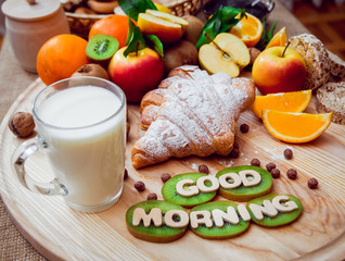 Beautiful breakfast. Milk, bread and croissant.
