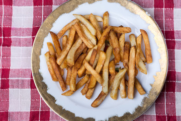 Top view of plate with fresh fryed french fries