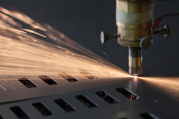 industrial Laser cutting process with sparks - obrazy, fototapety, plakaty