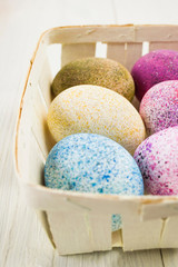Sprinkled Easter eggs in a wooden basket