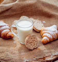 Beautiful breakfast. Milk, bread and croissant.