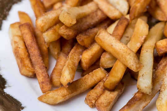 Close macro view of french fries on the plate
