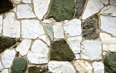Earth tone Cement stone wall texture grunge. Concrete puzzle. Green earthy natural color for background. Close up.