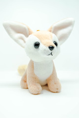 Brown dog with big ears stuffed like chihuahua dog or fox doll