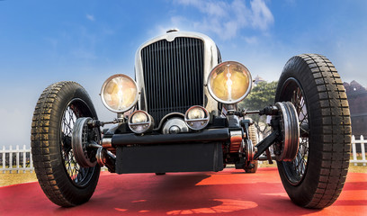 Front lower angle view of a retro vintage sports car