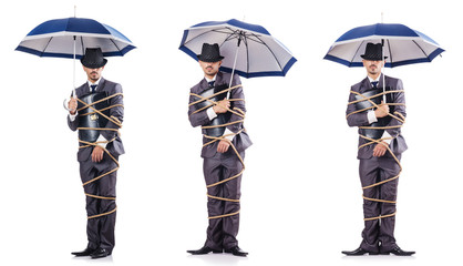 Businessman tied up with rope