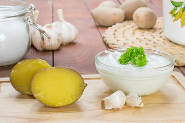 Cut Jacket Potatoes with Garlic Dip