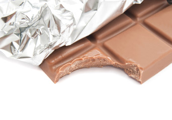 tiles of milk chocolate on white