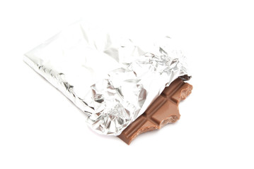 tiles of milk chocolate in a foil