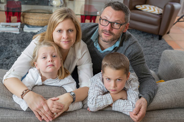 Family relaxing on sofa