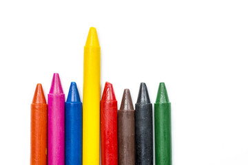 differentiate concept, colorful oil pastel crayons on white background