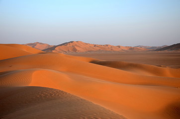 Fototapeta na wymiar Sand dunes and blue sky Oman