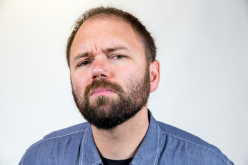 Obraz premium Man in Mid 30s Poses for Studio Portrait