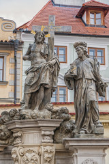Fototapeta na wymiar Statue of the Holy Savior with Cosmas and Damian on Charles Bridge in Prague, Czech