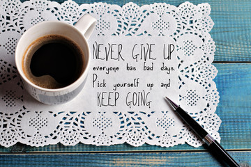 Inspiration motivation quotation  Never give up and keep going and cup of coffee Success concept