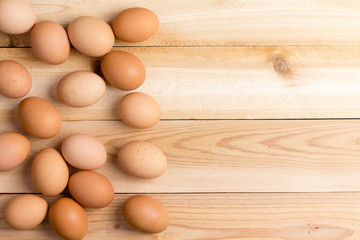 Farm fresh brown eggs on a wooden table