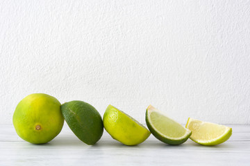 Limes on a white wood table
