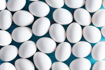 Background of white sugar-coated Easter eggs - 104768333