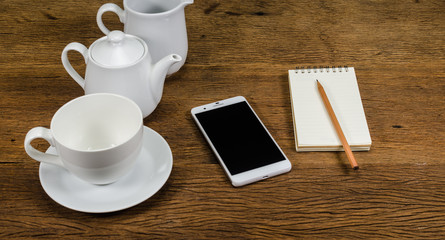 smart phone and notebook with coffee cup