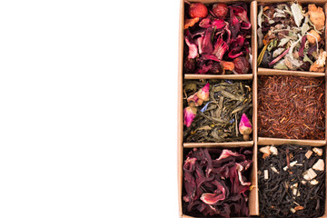 assortment of dry tea in a box, isolated on white