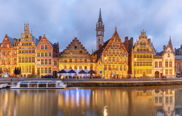Picturesque medieval building on the quay Graslei in Leie river at Ghent town at evening, Belgium