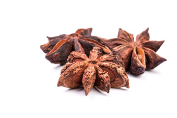 Star anise spice fruits and seeds isolated on white background