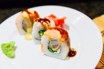 Traditional sushi rolls with salmon, cucumber and rice