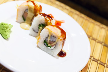 Sushi rolls with salmon, cucumber and rice