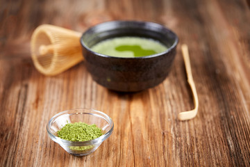 Green matcha tea on a wooden table