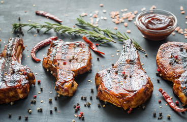 Grilled pork ribs on the wooden background
